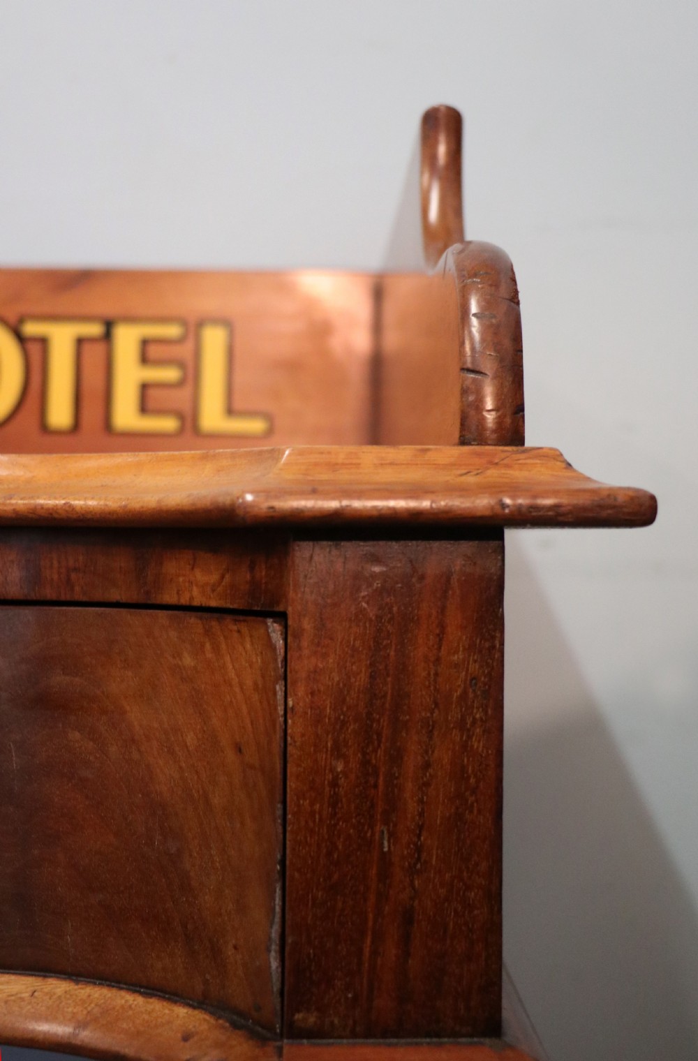 A Victorian mahogany console table with turned legs, a low gallery back, and yellow painted lettering reading Midland Grand Hotel Room 101. View XV