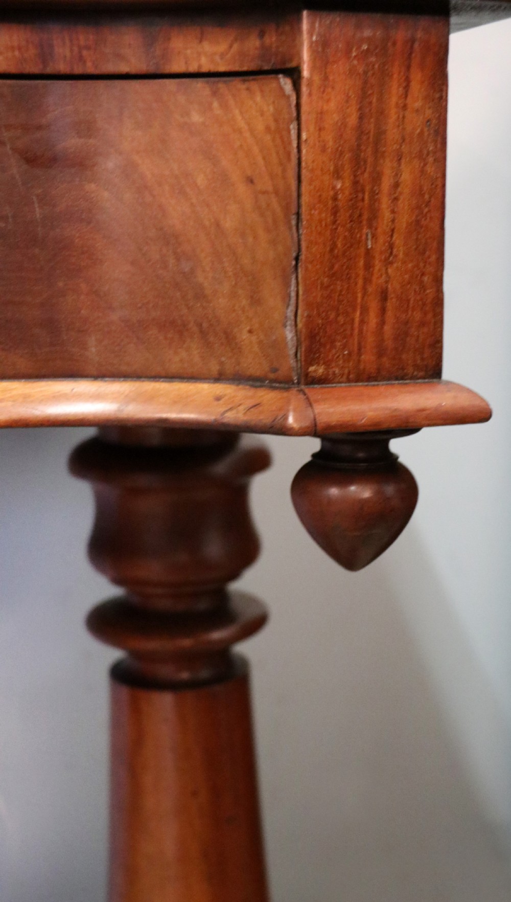 A Victorian mahogany console table with turned legs, a low gallery back, and yellow painted lettering reading Midland Grand Hotel Room 101. View XVII
