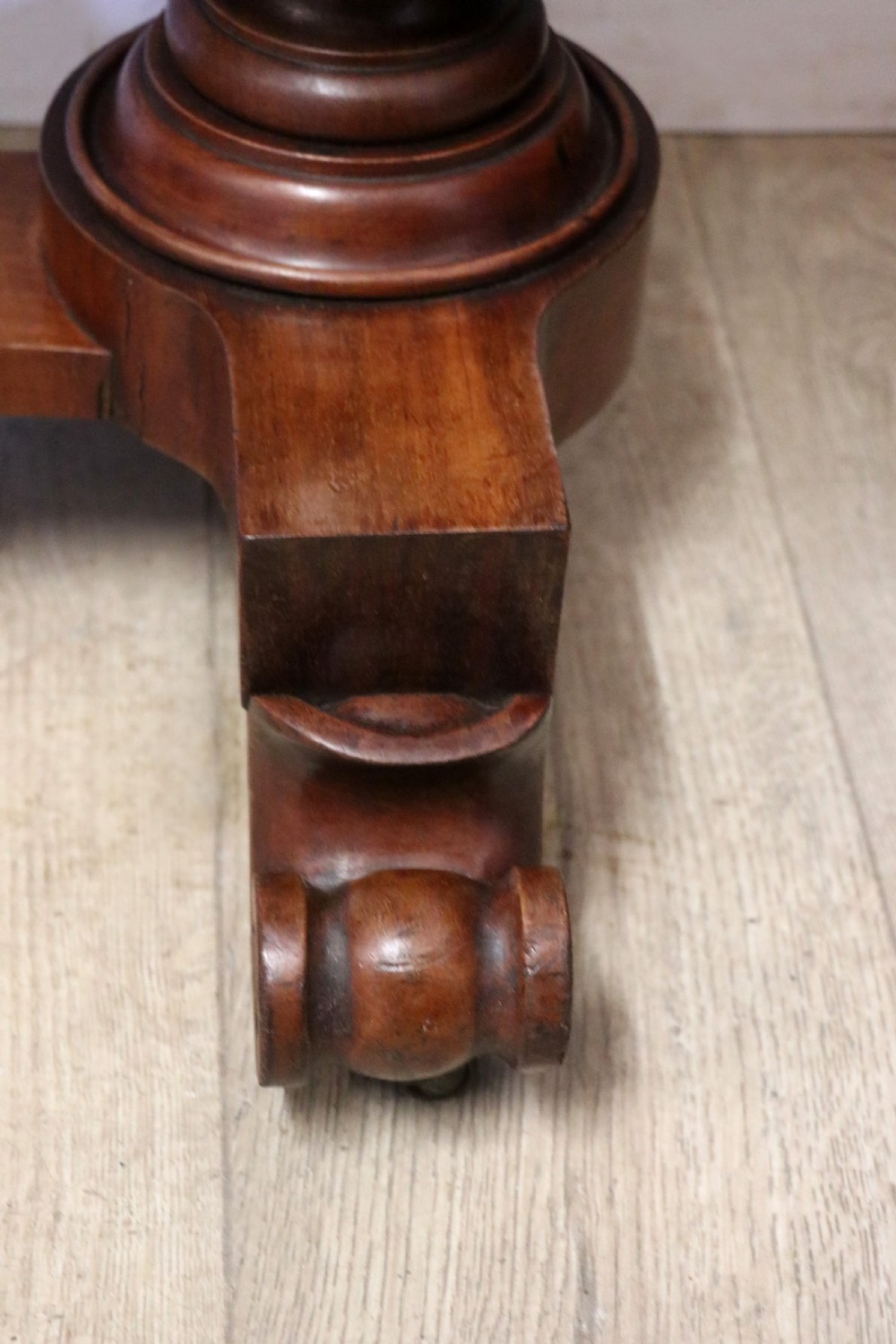 A Victorian mahogany console table with turned legs, a low gallery back, and yellow painted lettering reading Midland Grand Hotel Room 101. View XXII