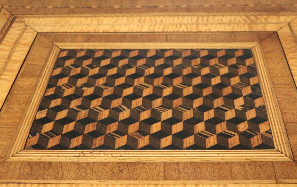 A late Victorian wooden occasional table featuring a geometric parquetry inlaid top, slender cabriole legs, and a lower glazed smokers cabinet. View VII