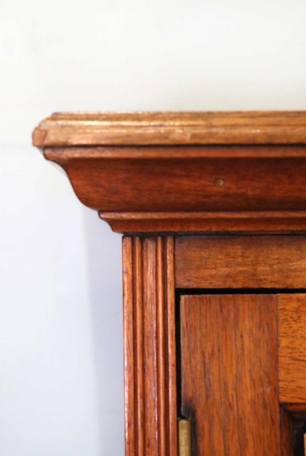 A superb late Victorian walnut framed wall cabinet, later sign written for Cadbury chocolate. View IV