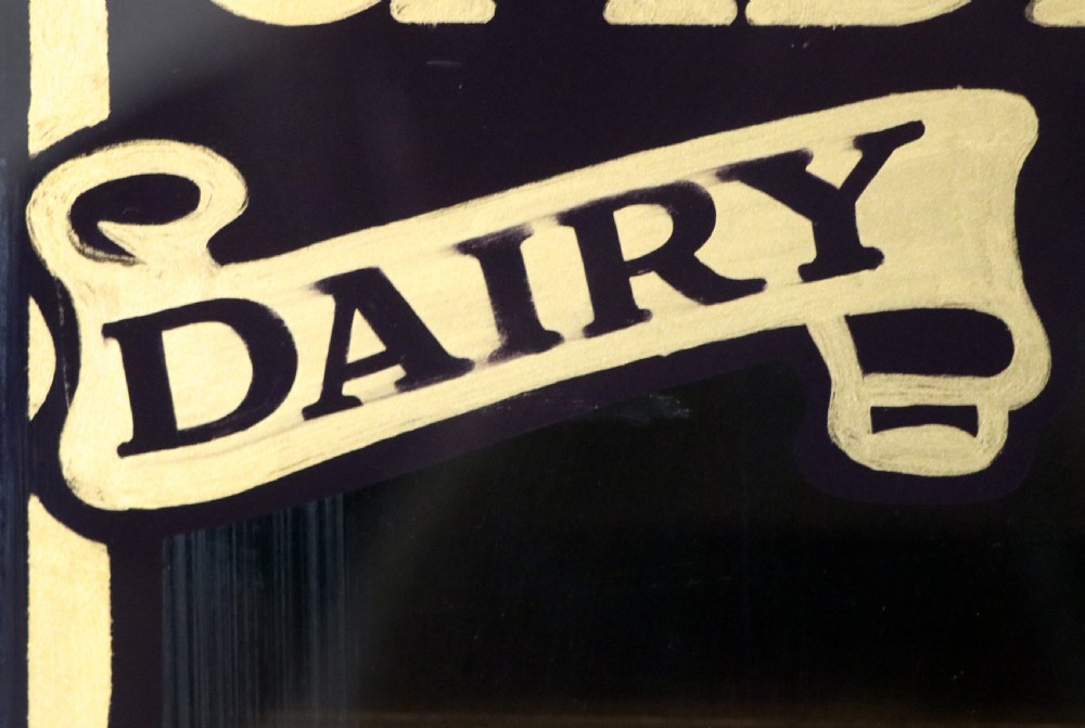 A superb late Victorian walnut framed wall cabinet, later sign written for Cadbury chocolate. View X