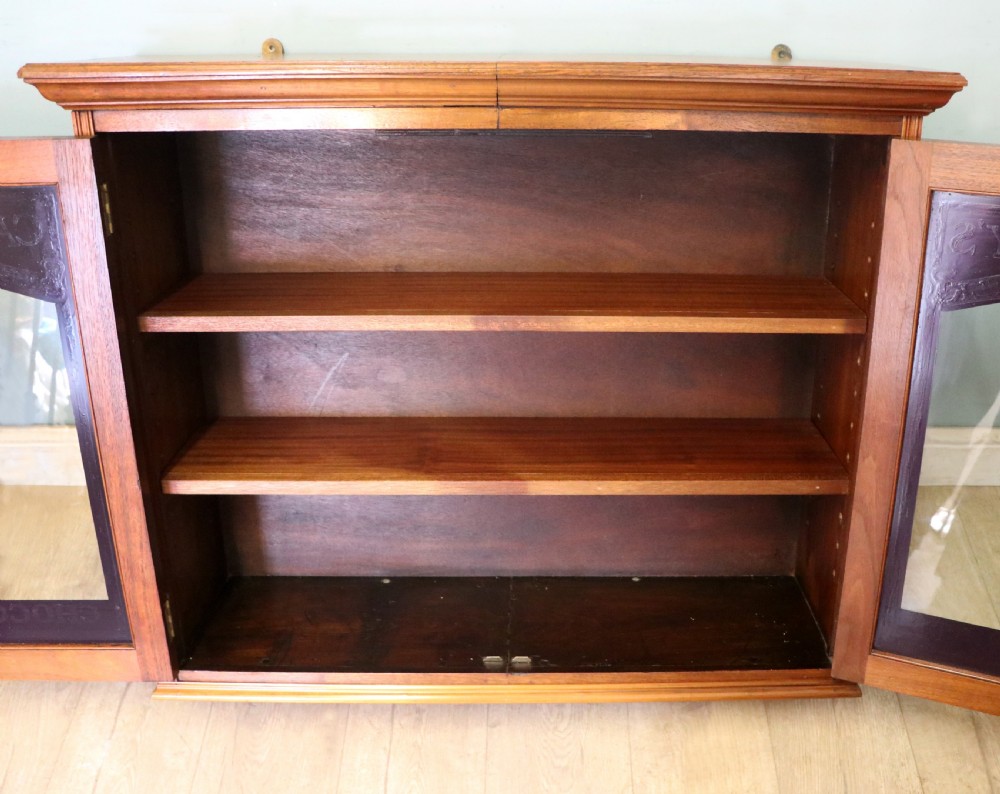 A superb late Victorian walnut framed wall cabinet, later sign written for Cadbury chocolate. View XVI