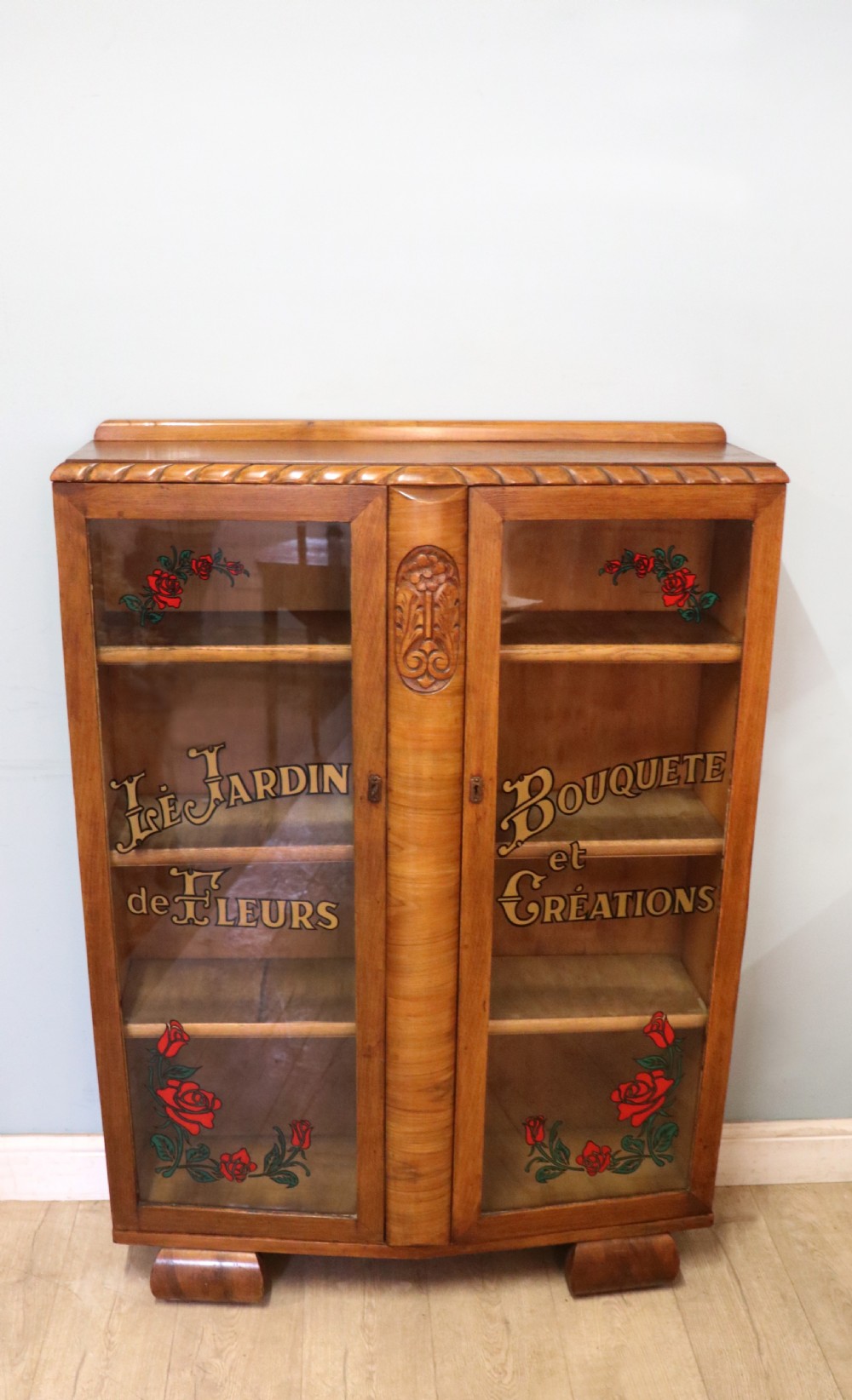 A lovely oak framed and walnut veneered bookcase cabinet.
