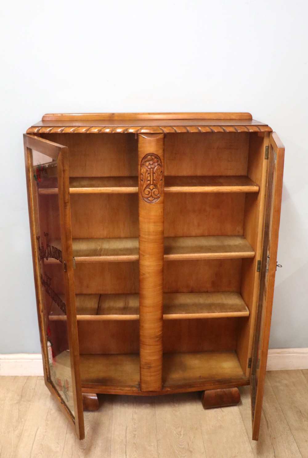 A lovely oak framed and walnut veneered bookcase cabinet. View IV