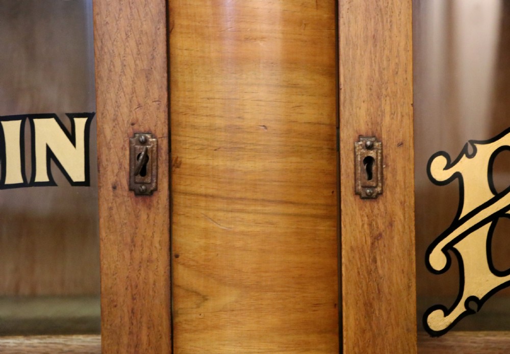 A lovely oak framed and walnut veneered bookcase cabinet. View XX
