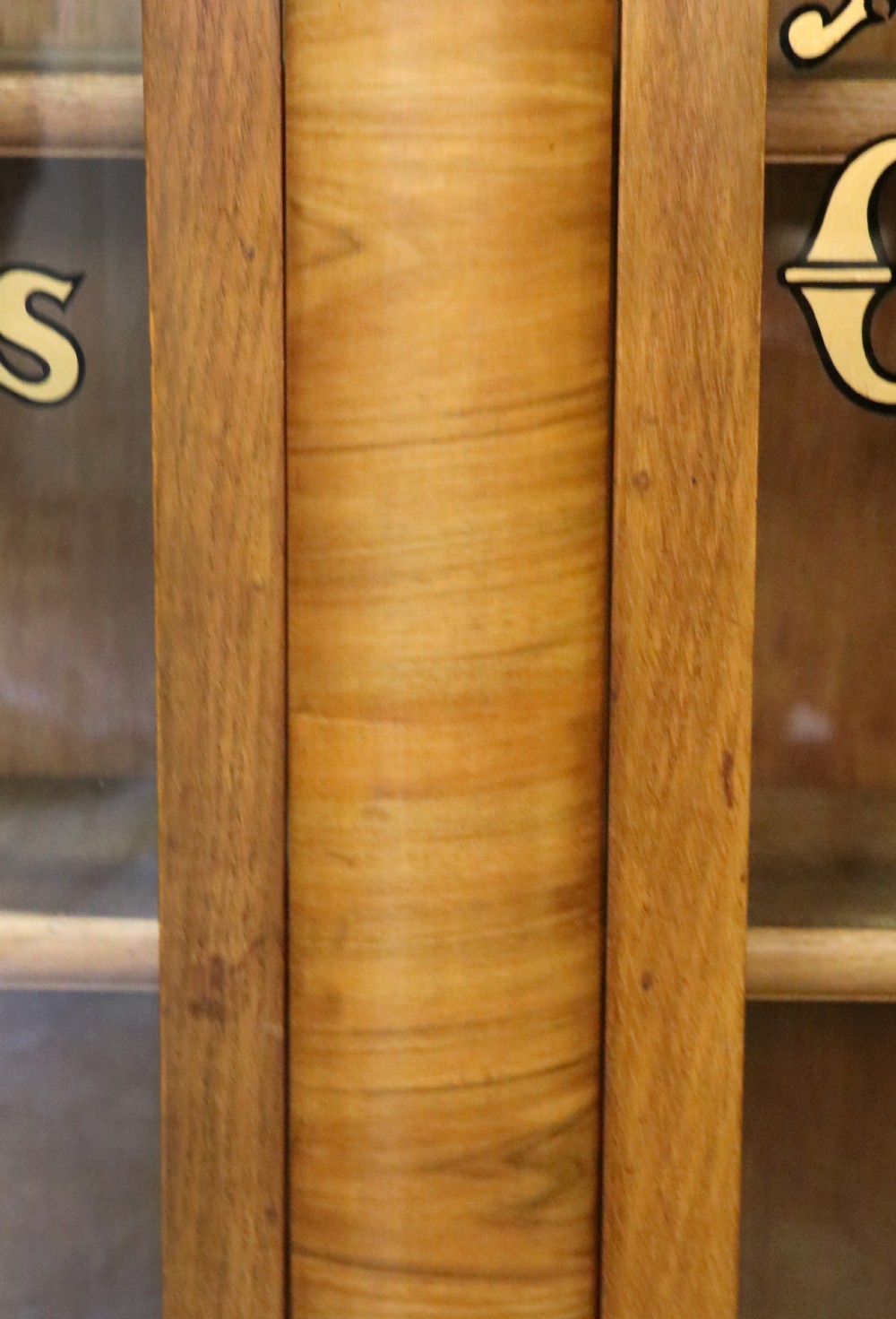 A lovely oak framed and walnut veneered bookcase cabinet. View XXI