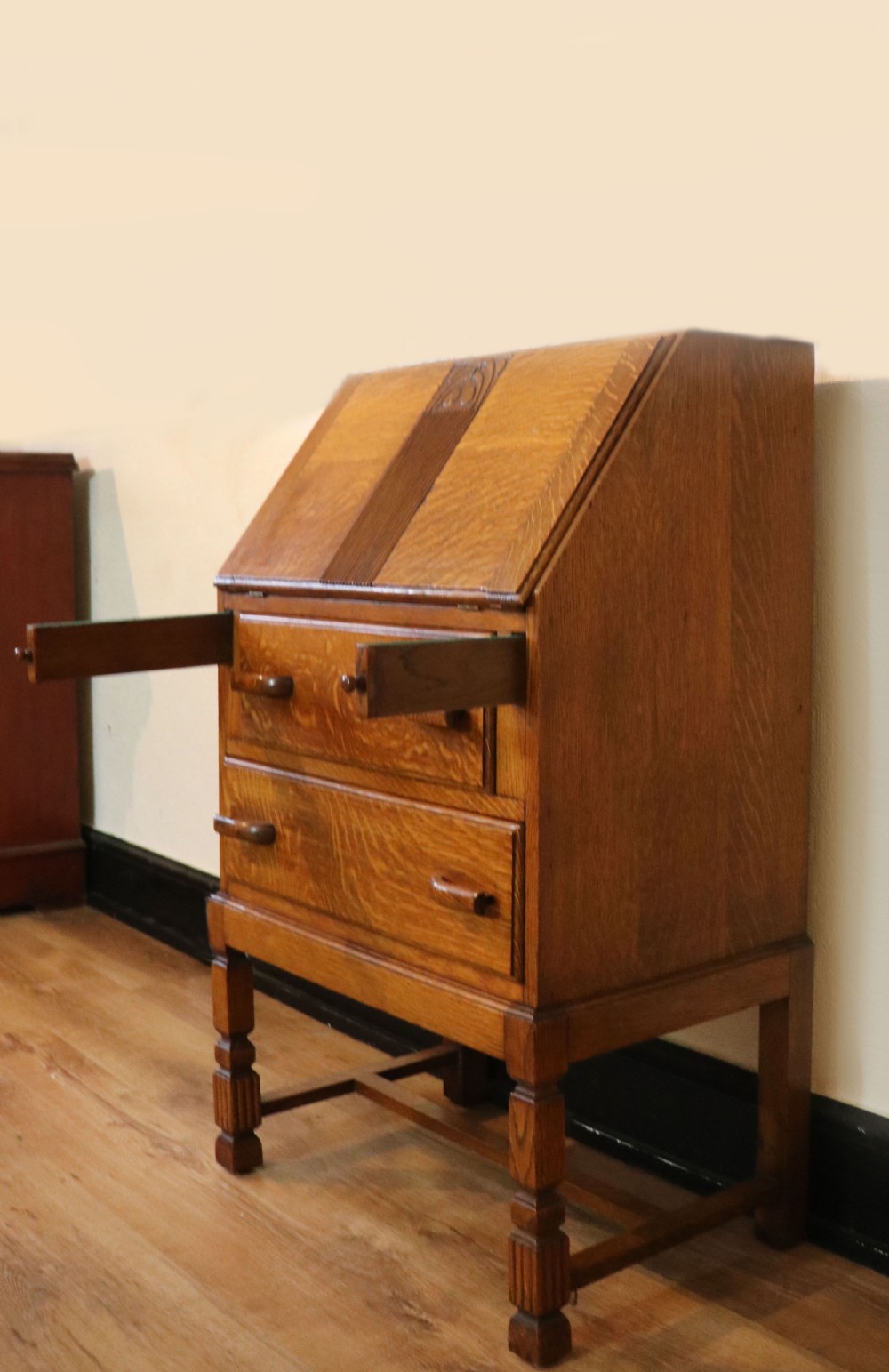 A lovely 1930s golden oak bureau.  View VIII