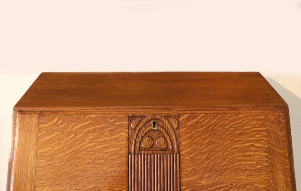 A lovely 1930s golden oak bureau.  View XI