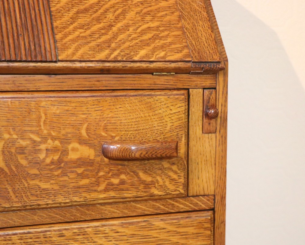 A lovely 1930s golden oak bureau.  View XIV