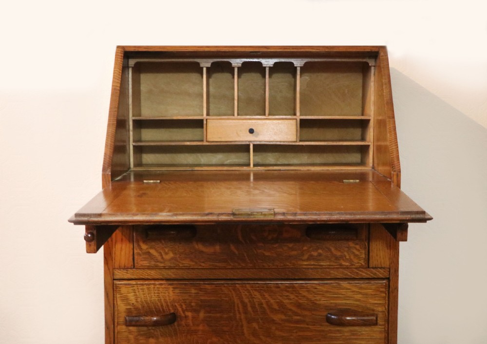 A lovely 1930s golden oak bureau.  View XV