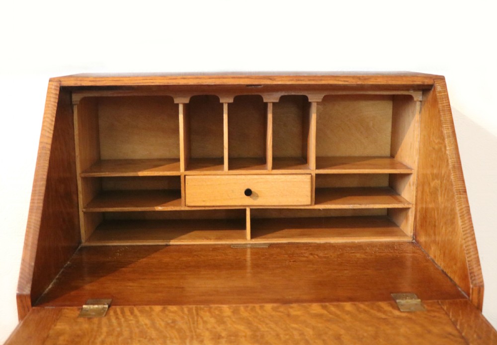 A lovely 1930s golden oak bureau.  View XVI
