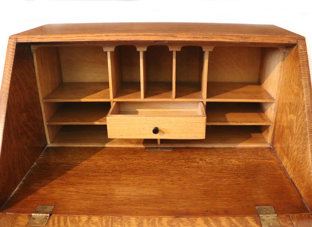 A lovely 1930s golden oak bureau.  View XVII