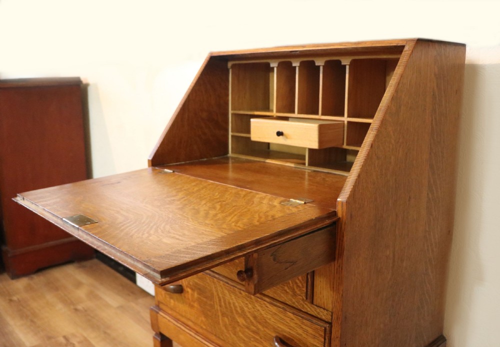 A lovely 1930s golden oak bureau.  View XVIII