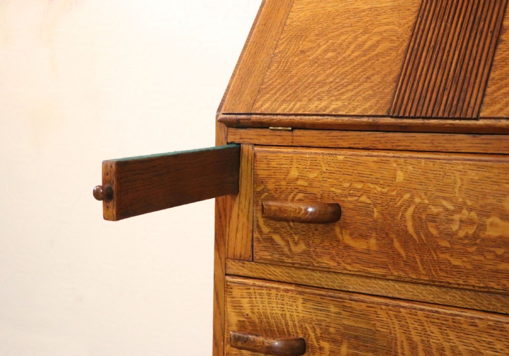 A lovely 1930s golden oak bureau.  View XXIII