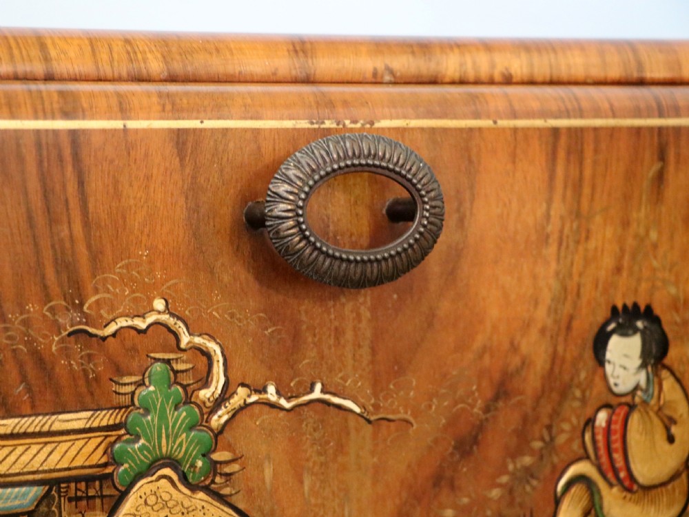 A wonderfully stylish piece of retro furniture An Art Deco walnut and chinoiserie-decorated cabinet by Rivington.  View X