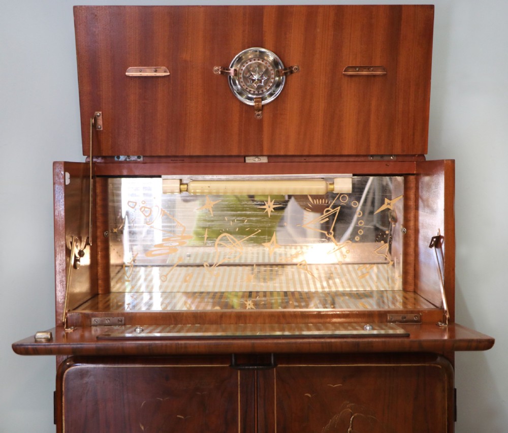 A wonderfully stylish piece of retro furniture An Art Deco walnut and chinoiserie-decorated cabinet by Rivington.  View XI