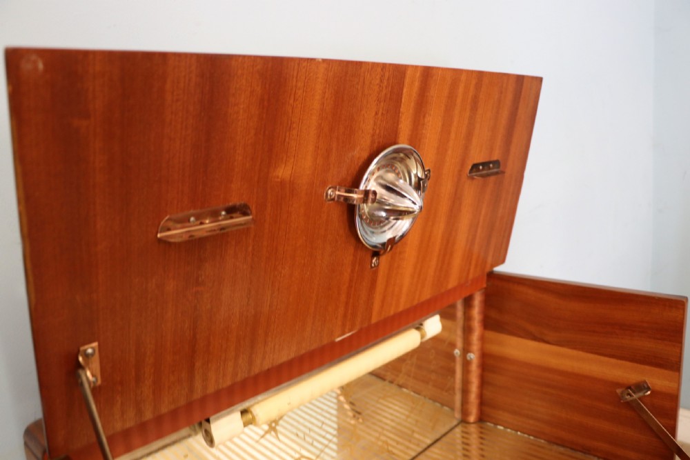 A wonderfully stylish piece of retro furniture An Art Deco walnut and chinoiserie-decorated cabinet by Rivington.  View XII