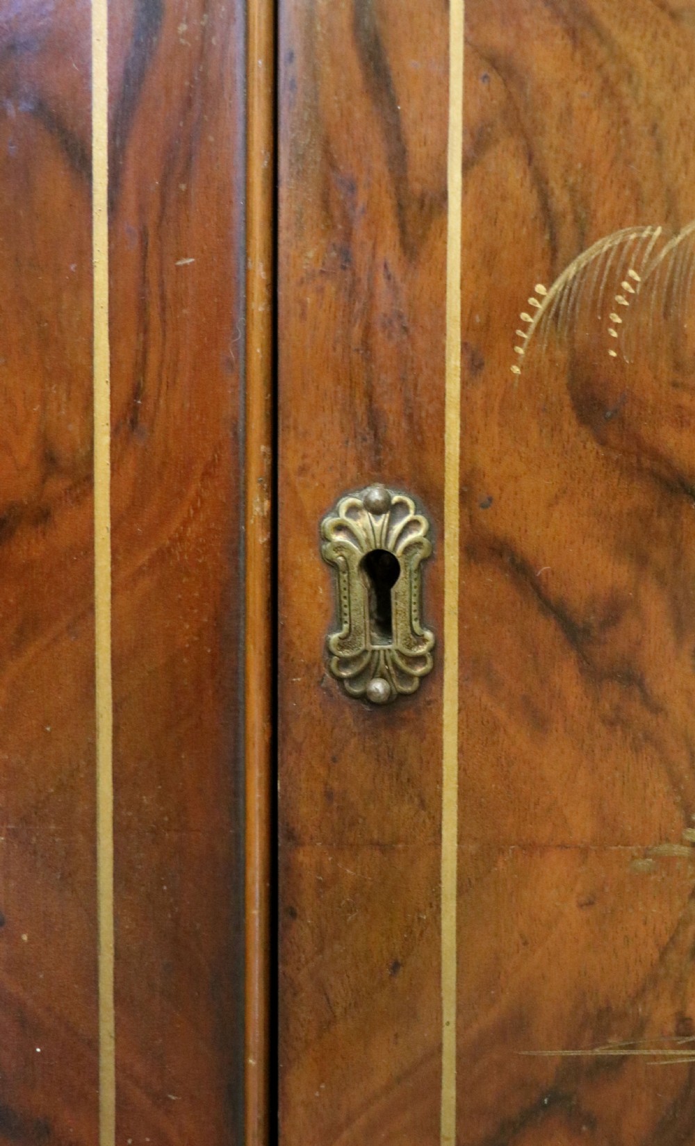 A wonderfully stylish piece of retro furniture An Art Deco walnut and chinoiserie-decorated cabinet by Rivington.  View XXIV