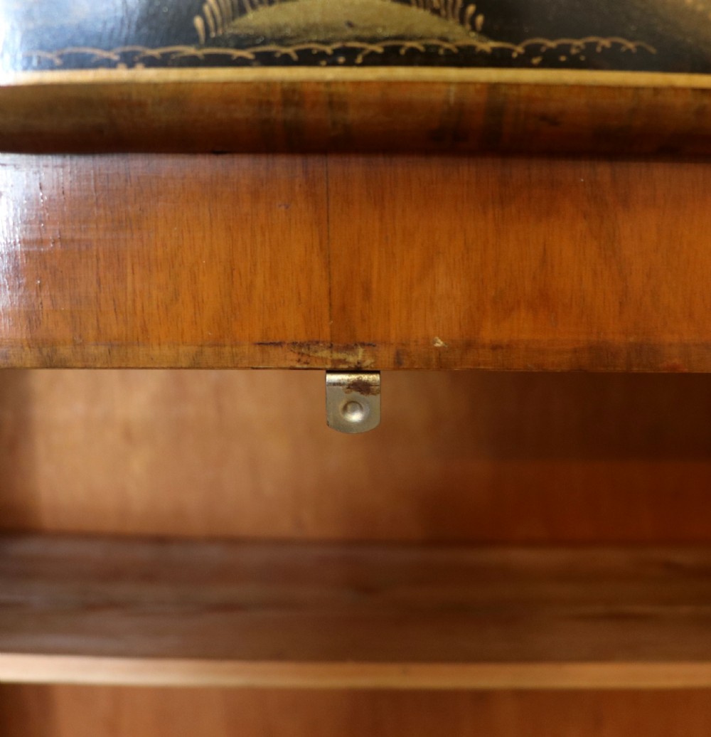 A wonderfully stylish piece of retro furniture An Art Deco walnut and chinoiserie-decorated cabinet by Rivington.  View XXVI