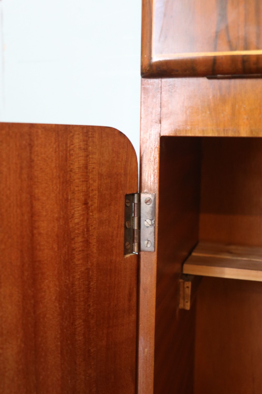 A wonderfully stylish piece of retro furniture An Art Deco walnut and chinoiserie-decorated cabinet by Rivington.  View XXVIII