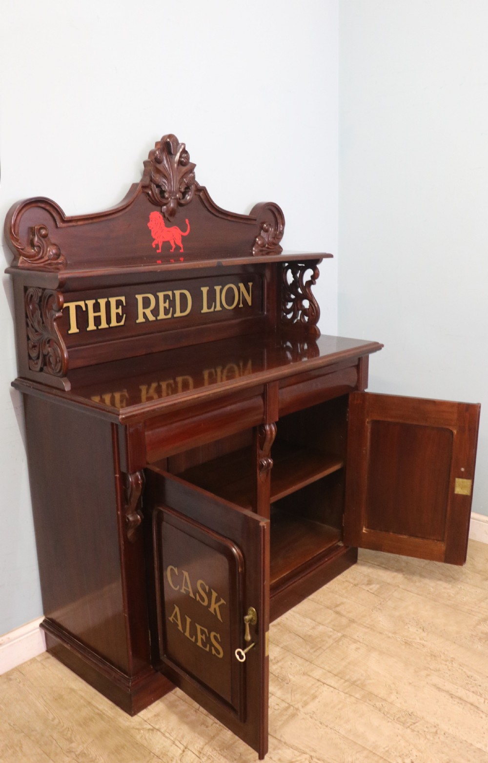 A Victorian mahogany chiffonier sideboard featuring hand-painted Red Lion pub lettering on the upper shelf back and lower cupboard doors. View VI