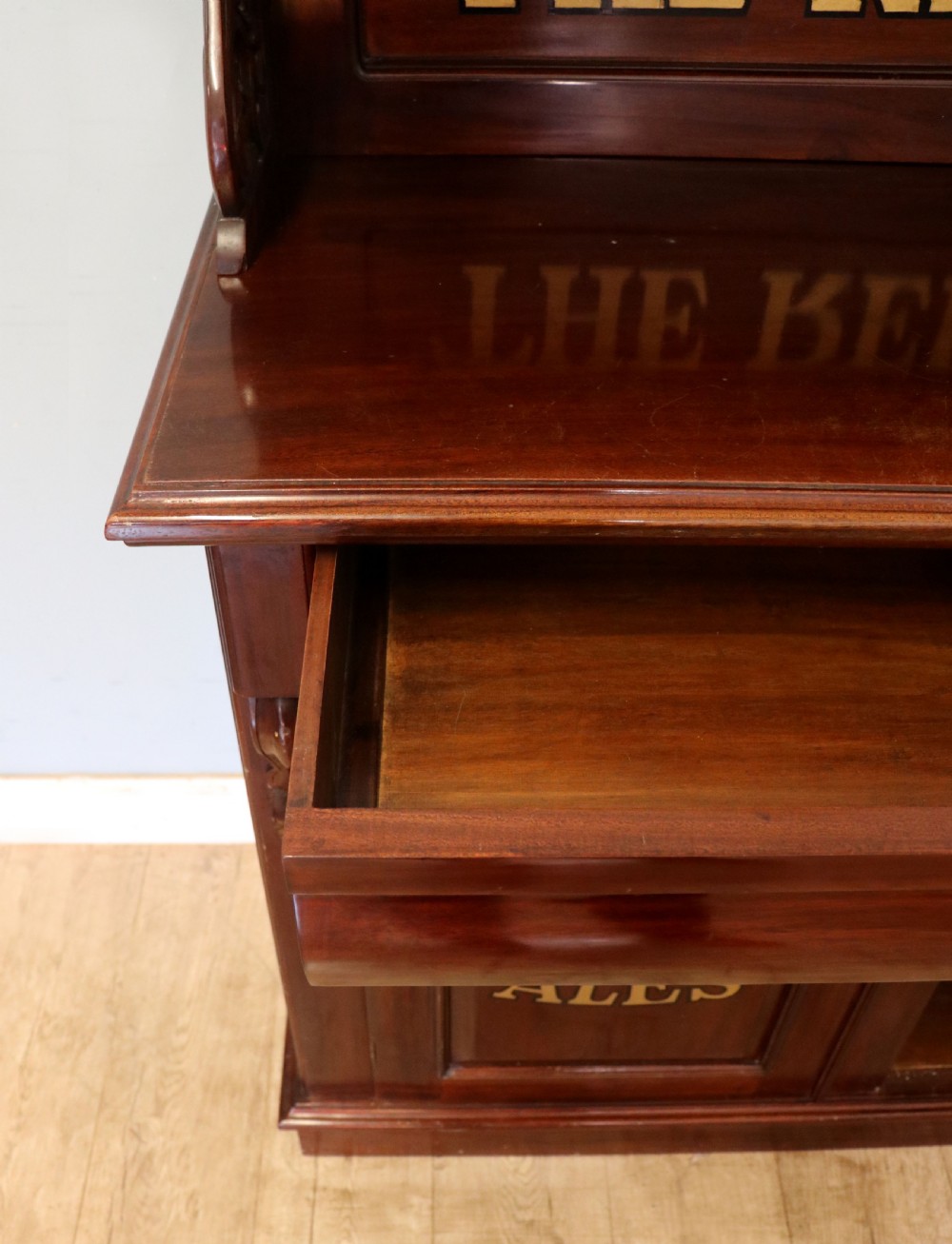 A Victorian mahogany chiffonier sideboard featuring hand-painted Red Lion pub lettering on the upper shelf back and lower cupboard doors. View XVII
