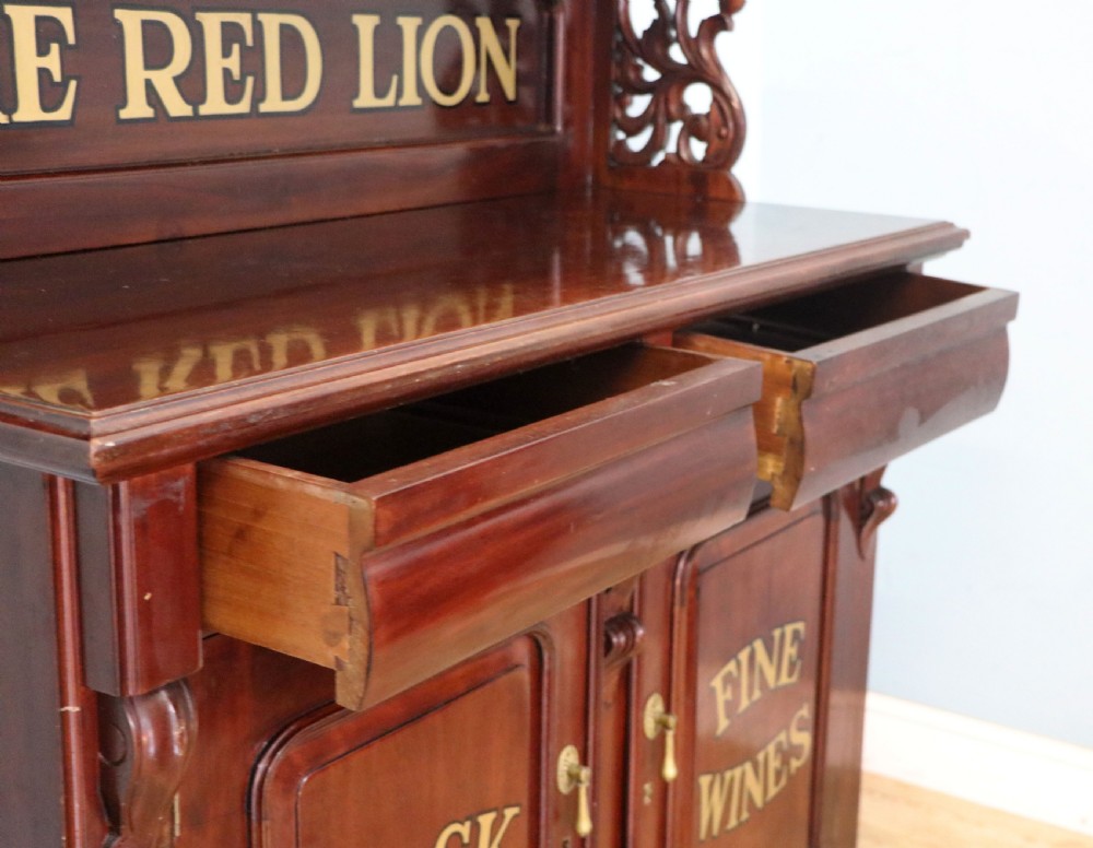 A Victorian mahogany chiffonier sideboard featuring hand-painted Red Lion pub lettering on the upper shelf back and lower cupboard doors. View XXV