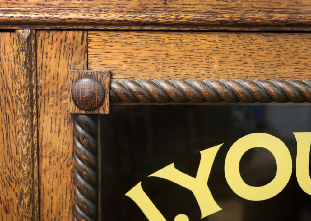 A simply charming 1930’s oak framed and glazed two door bookcase or display cabinet. View XVI