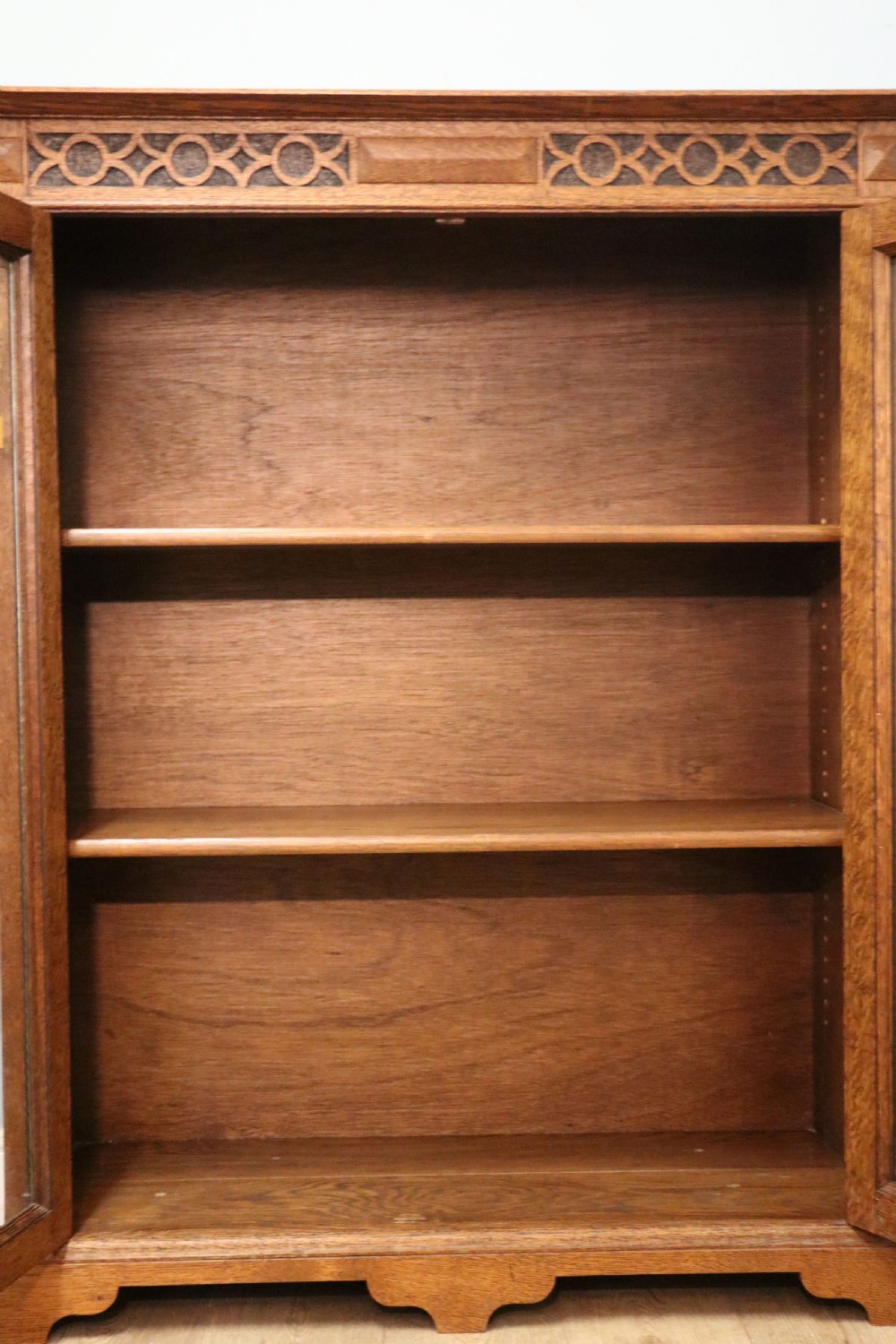 A simply charming 1930’s oak framed and glazed two door bookcase or display cabinet. View XXV