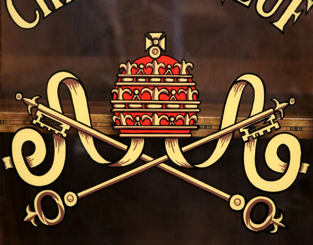 An early 20th-century French wooden display cabinet featuring a marble top, cabriole legs, gilt bronze mounts, and glass doors with hand-painted Chateauneuf-du-Pape lettering. View IX