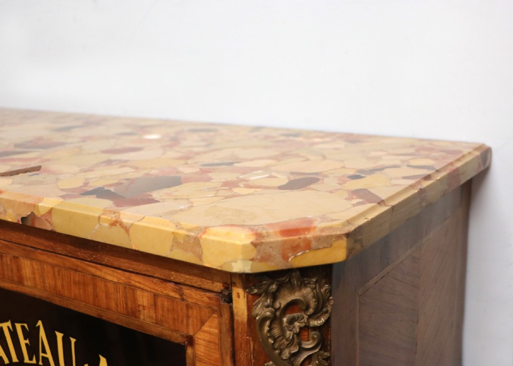 An early 20th-century French wooden display cabinet featuring a marble top, cabriole legs, gilt bronze mounts, and glass doors with hand-painted Chateauneuf-du-Pape lettering. View XIII