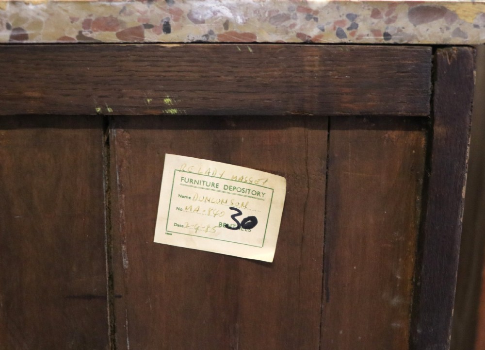 An early 20th-century French wooden display cabinet featuring a marble top, cabriole legs, gilt bronze mounts, and glass doors with hand-painted Chateauneuf-du-Pape lettering. View XXIX