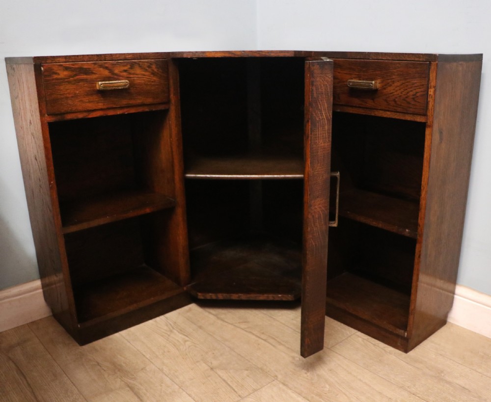 A lovely unusual oak corner bookcase dating to the 1920/30s.  View IV