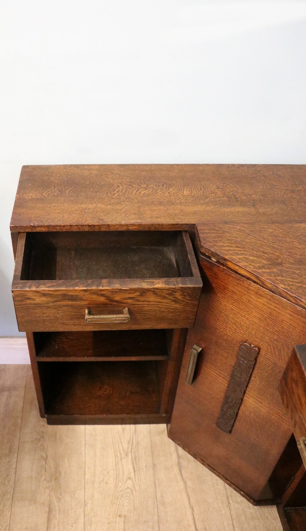 A lovely unusual oak corner bookcase dating to the 1920/30s.  View VI