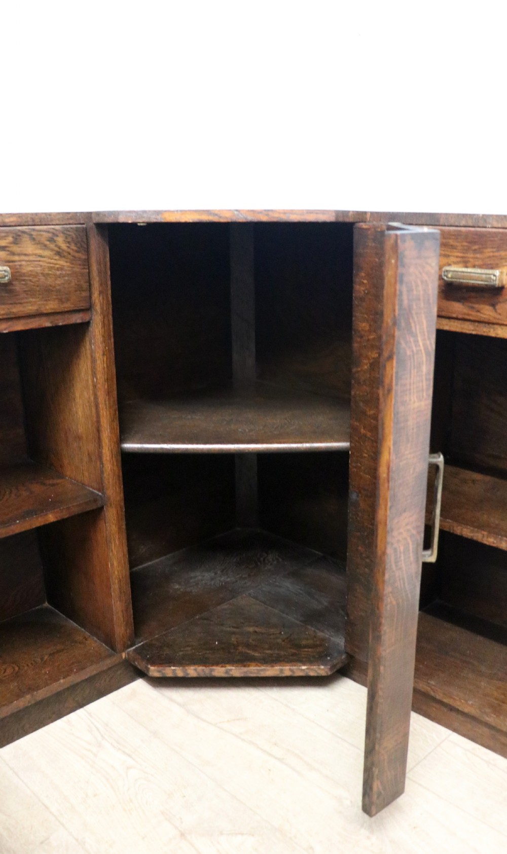 A lovely unusual oak corner bookcase dating to the 1920/30s.  View XV