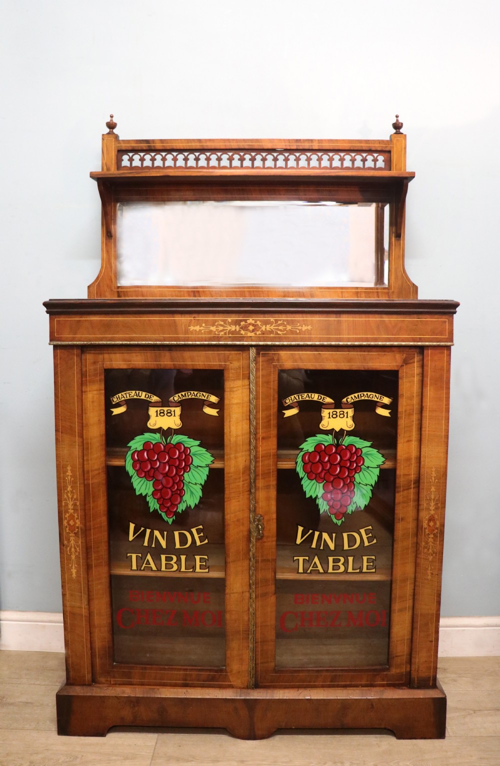 A lovely late Victorian walnut veneered and inlaid bookcase or display cabinet. 