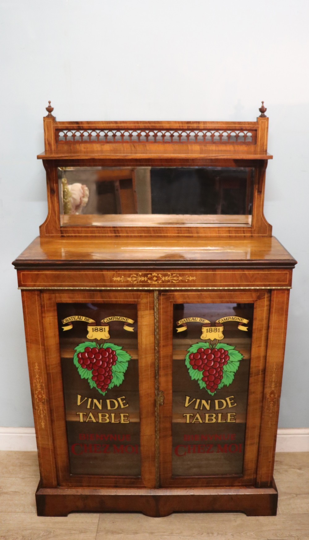 A lovely late Victorian walnut veneered and inlaid bookcase or display cabinet.  View II