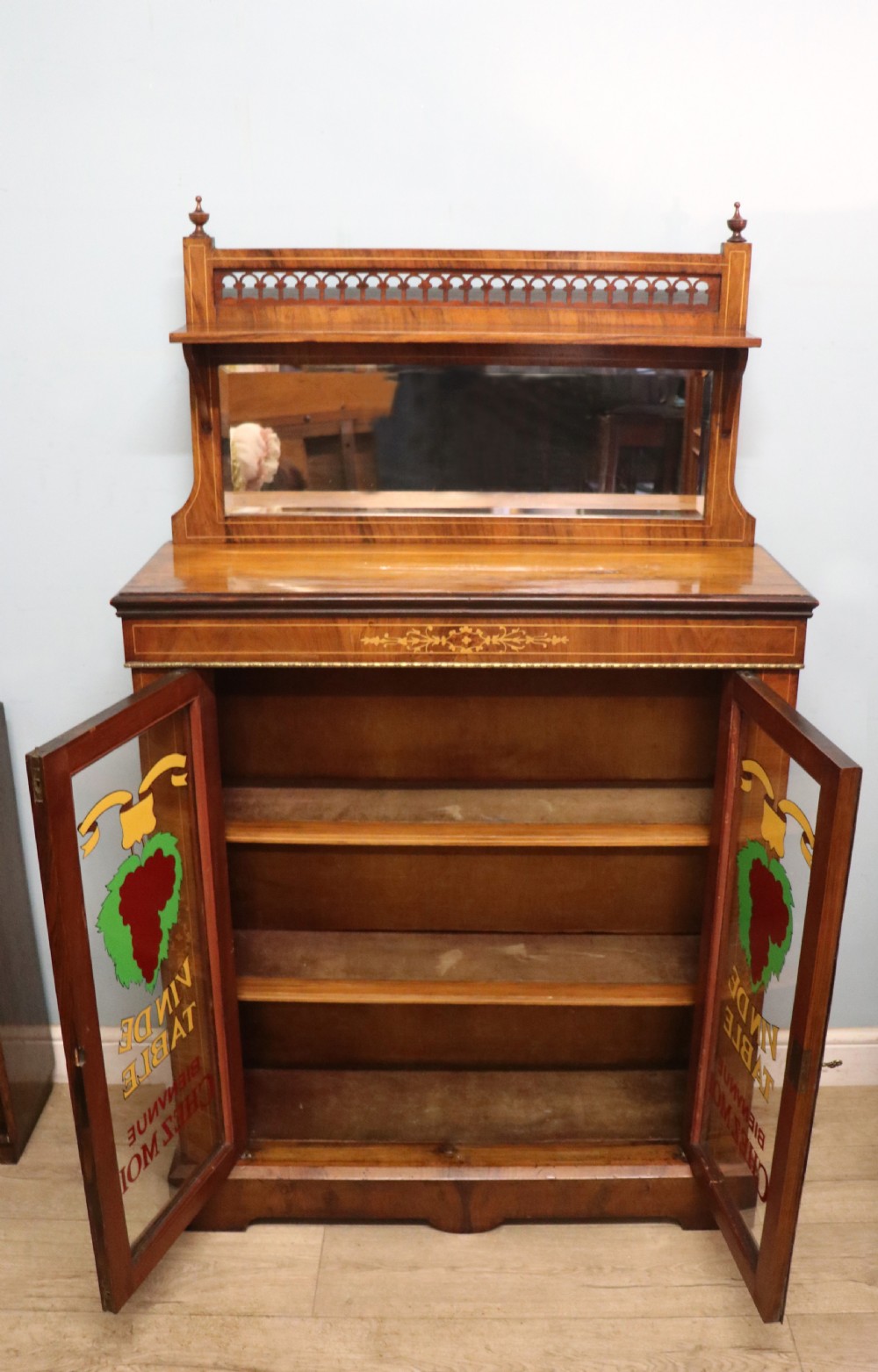 A lovely late Victorian walnut veneered and inlaid bookcase or display cabinet.  View III