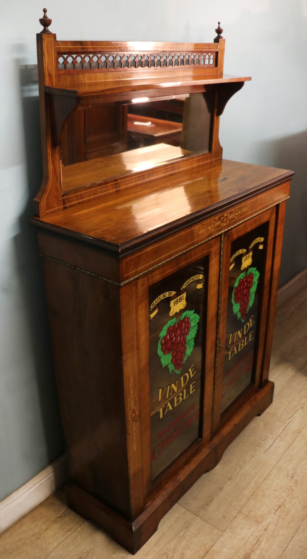A lovely late Victorian walnut veneered and inlaid bookcase or display cabinet.  View IV