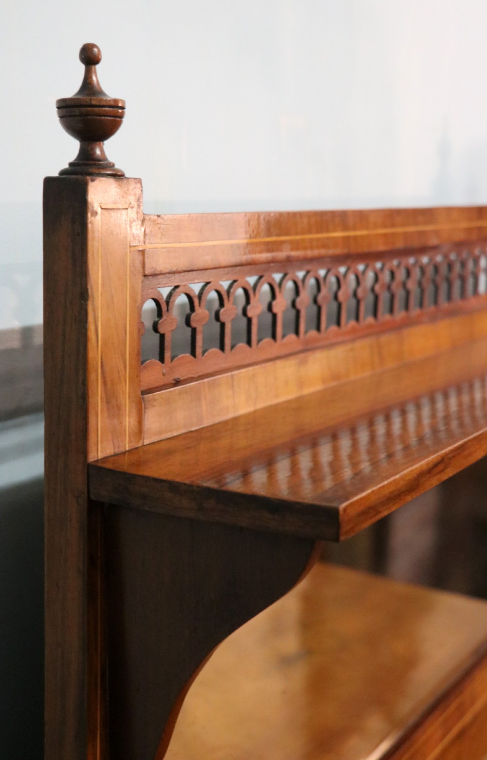A lovely late Victorian walnut veneered and inlaid bookcase or display cabinet.  View VI