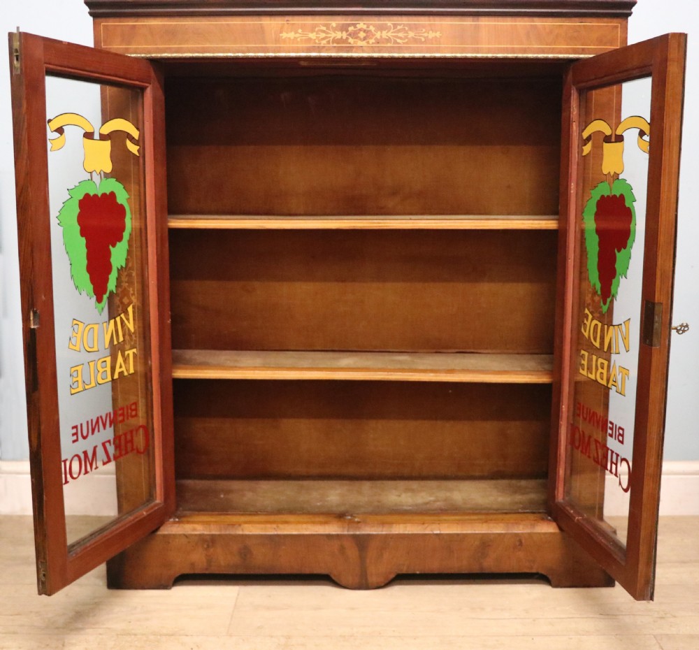 A lovely late Victorian walnut veneered and inlaid bookcase or display cabinet.  View XIX