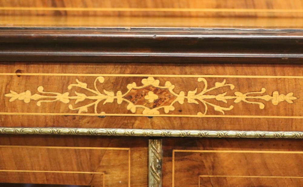 A lovely late Victorian walnut veneered and inlaid bookcase or display cabinet.  View XXIX