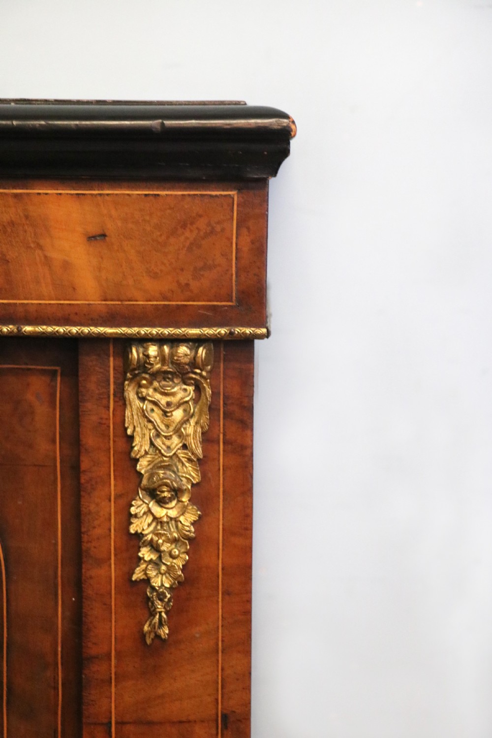 A Victorian walnut veneered and inlaid pier type display cabinet, with advertising for champagne producers Moet & Chandon. View VIII