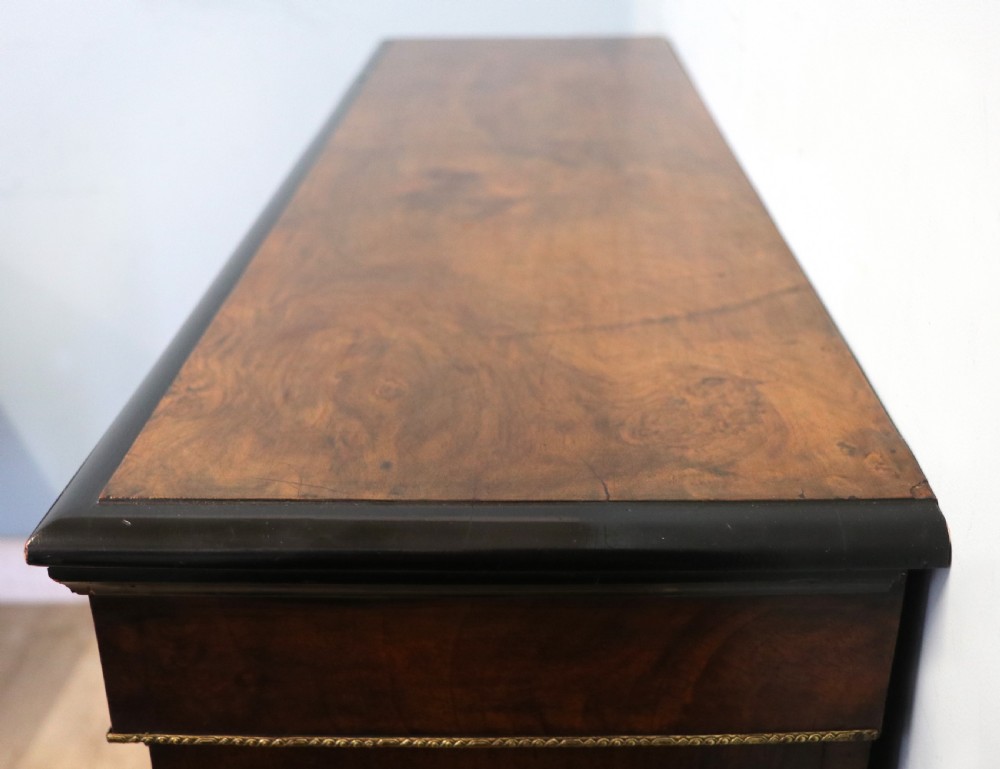 A Victorian walnut veneered and inlaid pier type display cabinet, with advertising for champagne producers Moet & Chandon. View IX