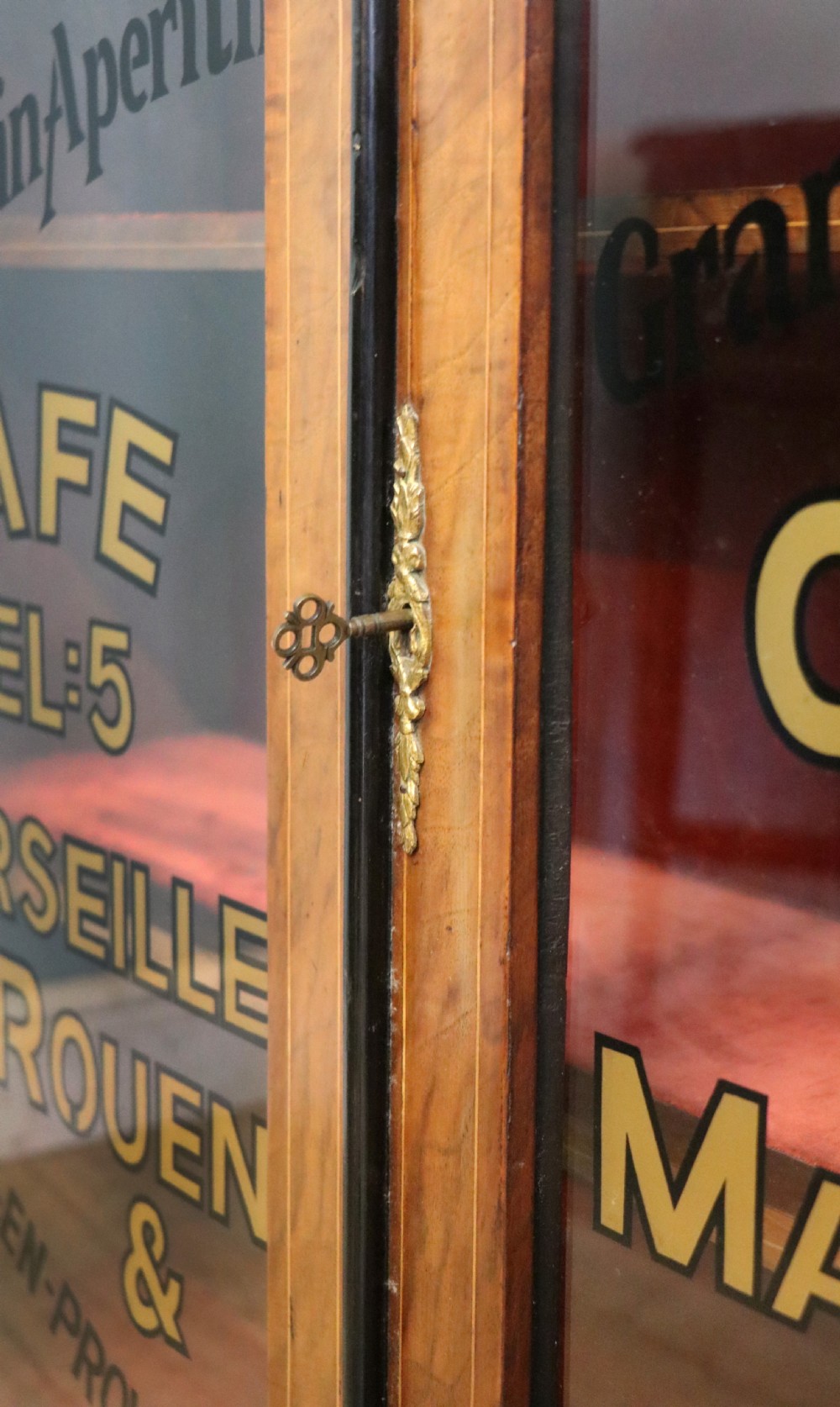 A Victorian walnut veneered and inlaid pier type display cabinet, with advertising for champagne producers Moet & Chandon. View XVI