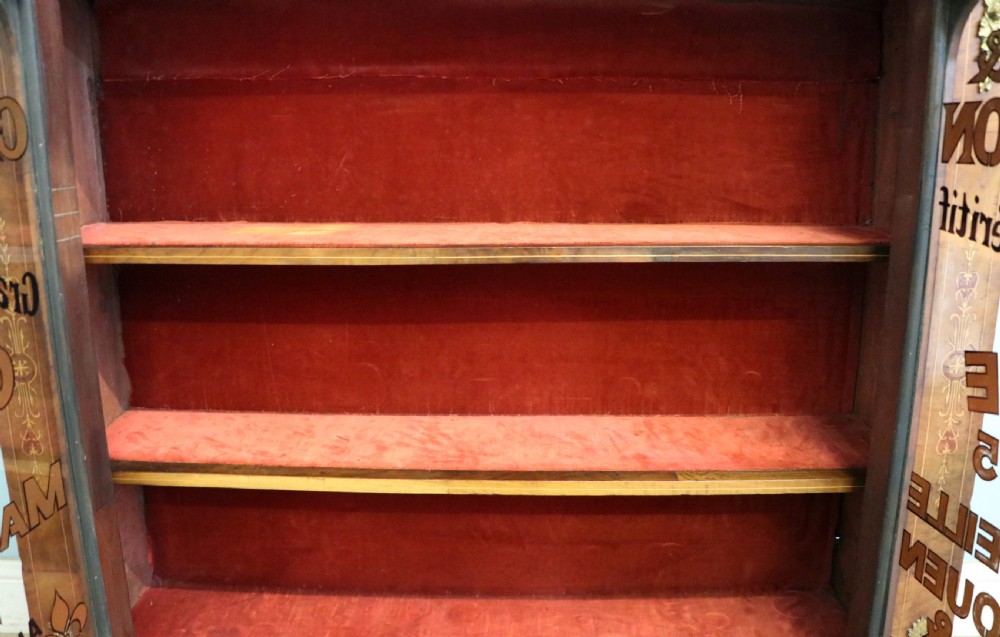 A Victorian walnut veneered and inlaid pier type display cabinet, with advertising for champagne producers Moet & Chandon. View XVII