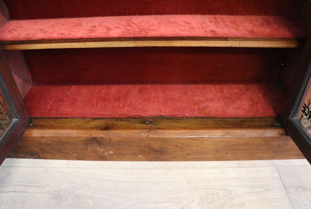 A Victorian walnut veneered and inlaid pier type display cabinet, with advertising for champagne producers Moet & Chandon. View XIX