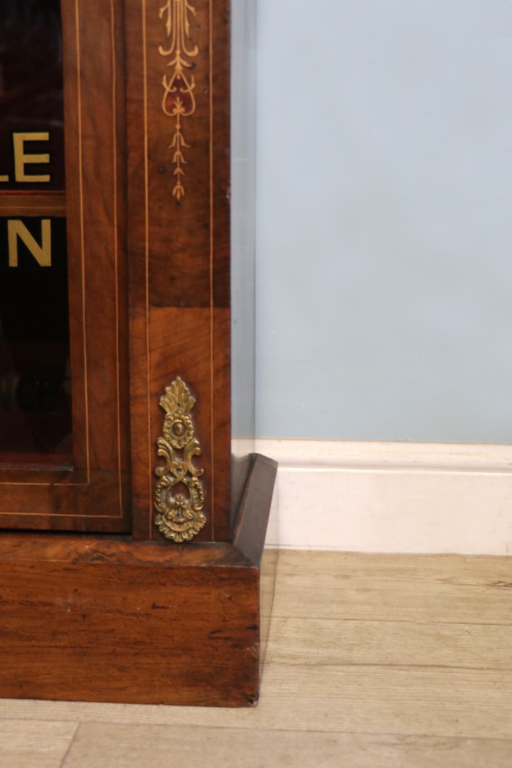 A Victorian walnut veneered and inlaid pier type display cabinet, with advertising for champagne producers Moet & Chandon. View XXV