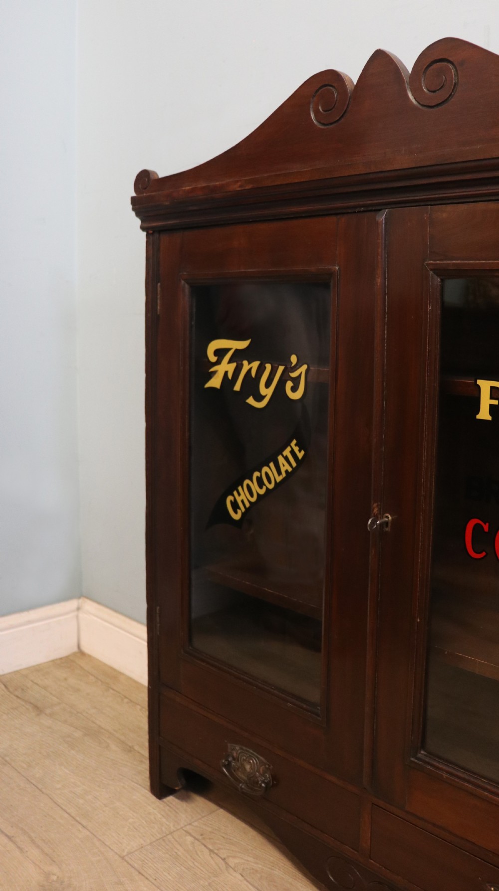 A late Victorian mahogany bookcase or display cabinet, later hand sign written for Fry’s cocoa and chocolate.  View XIII